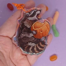 Load and play video in Gallery viewer, Pumpkin Raccoon holographic acrylic keyring
